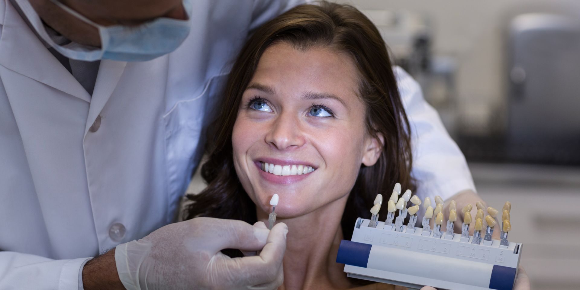 dentist-examining-female-patient-with-teeth-shades-2023-11-27-04-57-46-utc (1)
